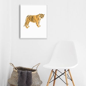 May include: A framed print of a stylized orange tiger with black stripes standing on a white background.