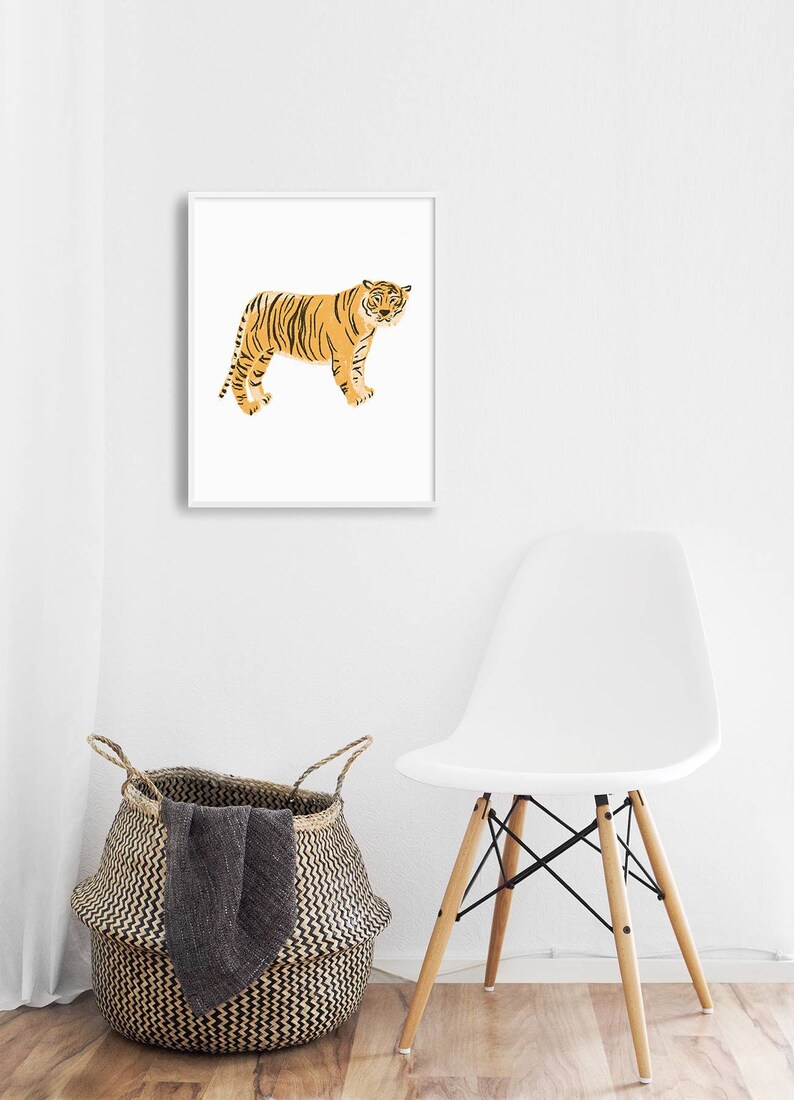 May include: A framed print of a stylized orange tiger with black stripes standing on a white background.