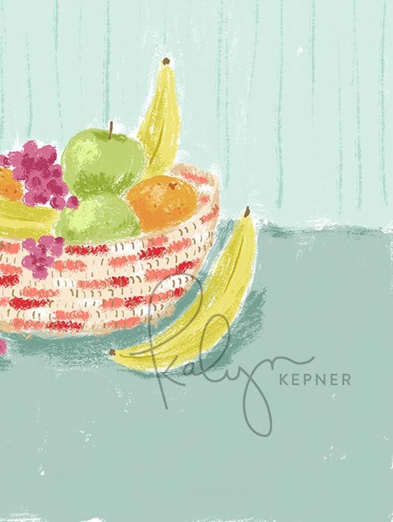 May include: A red and white striped bowl filled with fruit, including a green apple, a yellow banana, an orange, and grapes. A yellow banana is lying on the table next to the bowl.