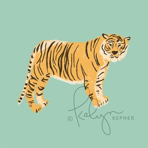 May include: A hand-drawn illustration of a tiger with orange and black stripes standing on a light blue background. The tiger is facing the right side of the image. The artist's signature, "Kaly Kepner", is in the bottom right corner of the image.