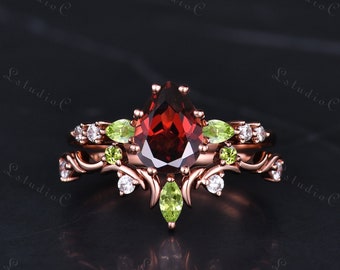 Birnenförmiger geschnittener roter Granatring-Set Roségold-Weinlese-Grün -Peridot-Verlobungsring-Set Moissanite-Braut-Set Einzigartige Zweig-Rebe-Ring-Frauen