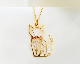 May include: A gold necklace with a geometric cat pendant. The pendant is made of thin metal and has a white enamel fill.