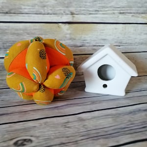Orange motor skills ball with rainbows