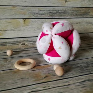 Montessori Fuchsia motif ball with stars.