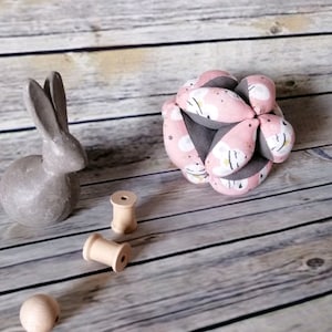 Pink and gray motility ball with mice