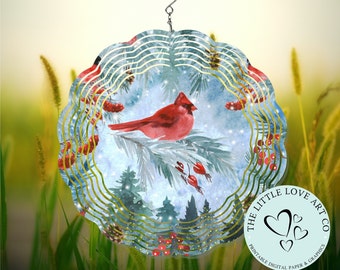 May include: A decorative wind spinner featuring a watercolor painting of a red cardinal perched on a pine branch with red berries. The design is set against a wintery blue and white background, with a gold wavy border and a hanging hook.