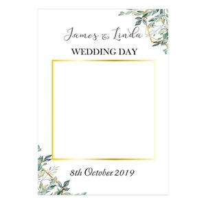 May include: A white wedding photo booth sign with gold accents and green foliage. The sign reads "James & Linda Wedding Day" and "8th October 2019".