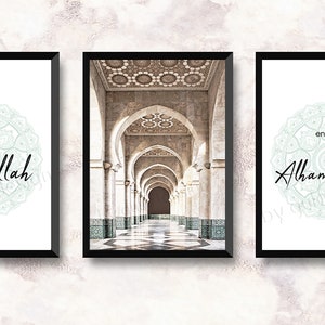 May include: Three framed prints with white backgrounds and black frames. The center print features a photograph of a long, arched hallway with white columns and a tiled floor. The left print features a green mandala with the text "start with Bismillah". The right print features a green mandala with the text "end with Alhamdulillah".