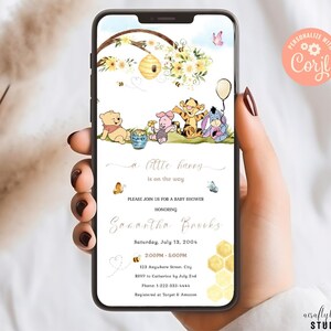 May include: A Winnie the Pooh themed baby shower invitation with a watercolor illustration of Winnie the Pooh, Piglet, Tigger, and Eeyore. The invitation is on a phone screen and includes the text "a little hunny is on the way" and "Please join us for a baby shower honoring Sonantha Brooks".