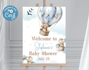 Könnte beinhalten: Willkommensschild für eine Babyparty mit einer Aquarellillustration eines Teddybären in einem Heißluftballon. Das Schild enthält den Text "Welcome to Stephanie's Baby Shower July 13" in Blau- und Brauntönen mit dekorativen Ballons.