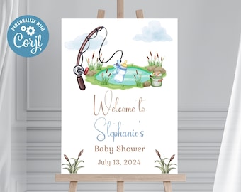 Op de afbeelding: Een welkomstbord voor een babyshower met een vissersthema. Het bord toont een cartoon hengel met een babyfles aan de lijn, een vijver en riet. De tekst op het bord luidt "Welkom op Stephanie's babyshower 13 juli 2024".
