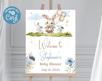 Könnte beinhalten: Ein Willkommens-Schild für eine Babyparty mit einer Aquarell-Illustration eines Hasen, der Ballons hält. Das Schild lautet "Willkommen zu Stephanies Babyparty am 13. Juli 2024".