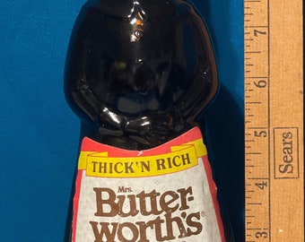 Antique Mrs Butterworth’s syrup bottle, glass bottle with some of the original label, 70&#39;s era.  DK Amber glass, flip up pour lid.