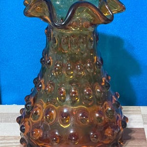 Vintage Fenton Art Glass Hobnail Amber Glass Vase features a Ruffled Rim. 70&#39;s era