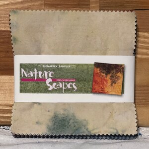 May include: A beige fabric square with a blue and green dye pattern. The fabric is labeled "Benartex Sampler Nature Scapes Triple-Dyed Balis".