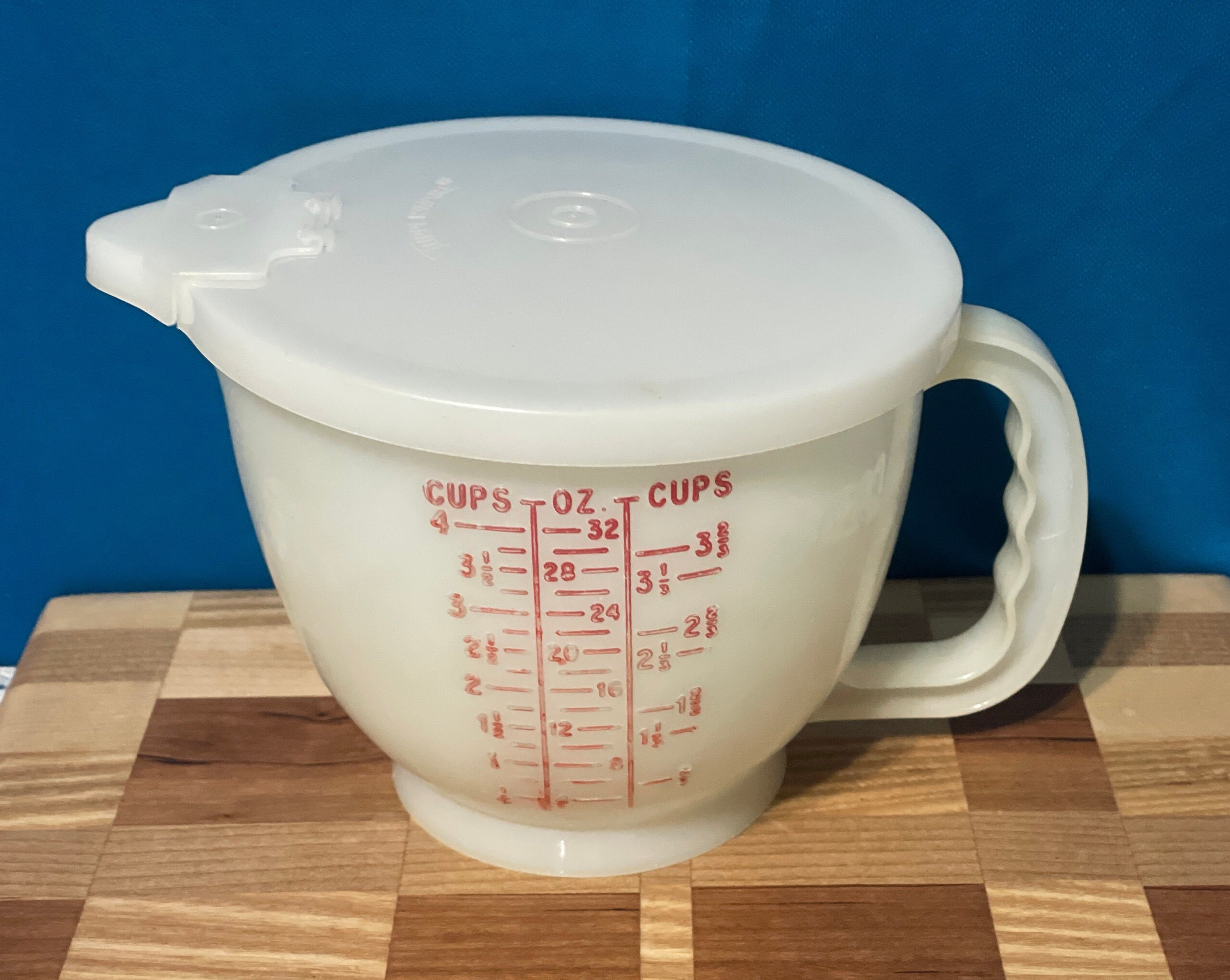 Sold at Auction: Large Tupperware Measuring cup, with lid