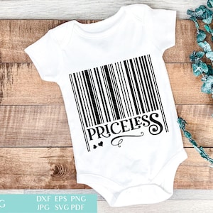 May include: White baby onesie with a black barcode design and the word "PRICELESS" in a decorative font. Two small hearts and a swirl accent the text. The onesie is displayed on a wooden surface.