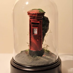 Miniature post box diorama over grown