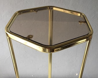 1960s brass plant stand - tripod legs - brown smoked glass shelf - hexagonal shape top - gold colour living room corner decoration