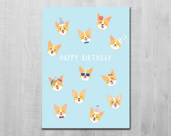 May include: A light blue card with the text "Happy Birthday" and a pattern of 10 cartoon corgis wearing different hats and accessories.
