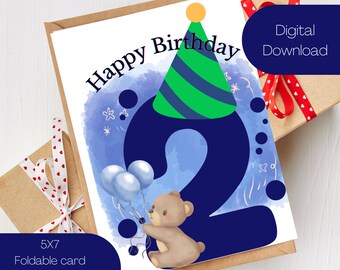 May include: A printable birthday card featuring a blue number two with a green and blue party hat on top. A brown teddy bear holds blue balloons in front of the number. The card has a watercolor background with white stars and the text "Happy Birthday" at the top.