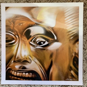 May include: A close-up of a golden mask with a wide-open mouth and a single eye visible. The mask is painted in a realistic style, with details like wrinkles and shadows.