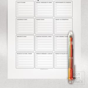 May include: A white to-do list notepad with sections for calls, emails, appointments, household tasks, and more. A multi-colored pen rests on the right side of the notepad. The notepad has the text "DOT DOT TRACE" at the bottom.