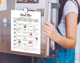 May include: A printable meal plan for the week of July 22nd to July 27th. The meal plan includes breakfast, lunch, dinner, and snacks for each day of the week. The meal plan is printed on white paper and is attached to a refrigerator with a magnet.