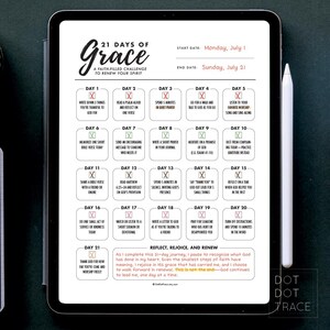 May include: A digital tablet displays a 21 Days of Grace challenge. The screen shows a daily schedule with prompts for reflection and prayer, starting Monday, July 1, and ending Sunday, July 21. A stylus rests on the right side.