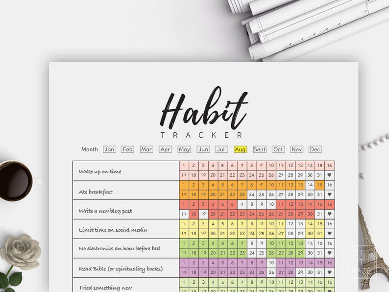 Pode incluir: Um rastreador de h&aacute;bitos imprim&iacute;vel com uma grade de calend&aacute;rio colorida. O rastreador inclui uma lista de h&aacute;bitos para rastrear, como acordar no hor&aacute;rio, tomar caf&eacute; da manh&atilde;, escrever uma postagem de blog, limitar o tempo nas redes sociais e ler a B&iacute;blia.