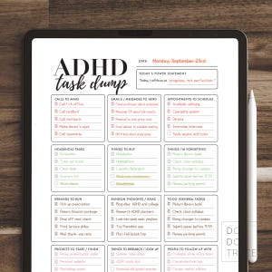May include: A digital planner on a tablet screen with the title "ADHD task dump." The planner includes sections for calls, emails, appointments, household tasks, errands, and to-do lists. A stylus rests on the right side of the screen.