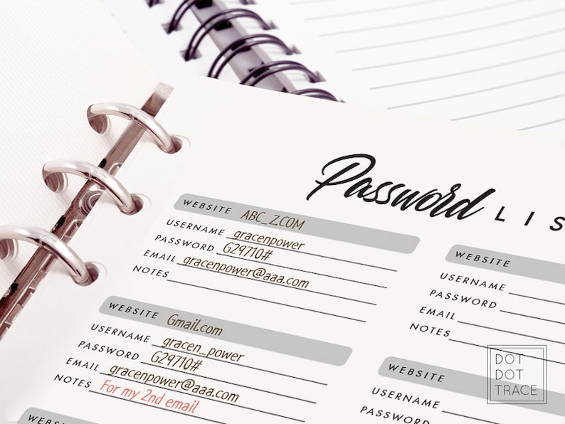 May include: A close-up of a password list written in a notebook. The notebook has a silver binder and the page is filled with handwritten website names, usernames, passwords, and email addresses. The text "Password List" is written at the top of the page.
