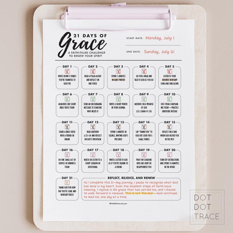 May include: A clipboard with a printed 21 Days of Grace faith-filled challenge. The schedule includes daily prompts for reflection and renewal, with the start date of Monday, July 1, and the end date of Sunday, July 21.
