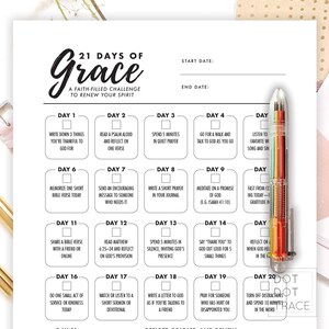 May include: A faith-filled challenge journal titled "21 Days of Grace" with prompts for daily reflection. The journal includes spaces for start and end dates, and a colorful pen is visible on the right side.