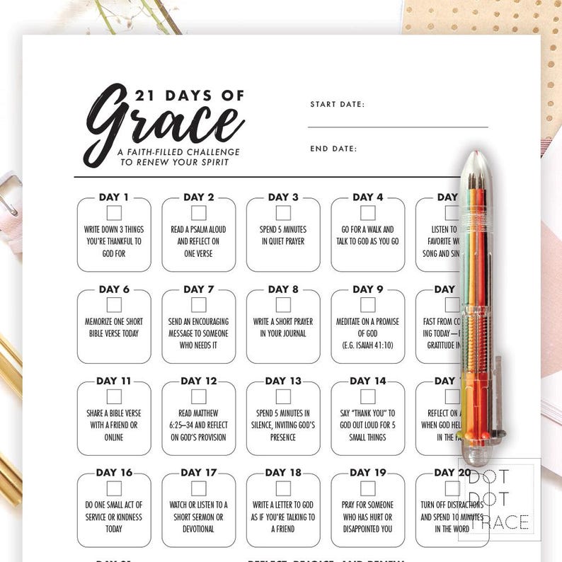 May include: A faith-filled challenge journal titled "21 Days of Grace" with prompts for daily reflection. The journal includes spaces for start and end dates, and a colorful pen is visible on the right side.