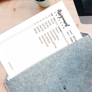 May include: A white printable assignment tracker with a black heading "Assignment Tracker" and a section for listing classes, assignments, and due dates. The tracker is labelled with the semester "2021 Fall" and the month "October".
