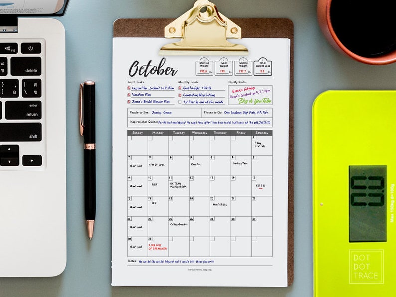 May include: A printable October calendar with a checklist for top 3 tasks, monthly goals, and on my radar. The calendar is on a clipboard with a gold clip. There is a black pen, a laptop, and a yellow digital scale in the background.