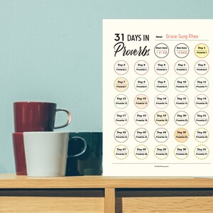 May include: A printable 31 Days in Proverbs chart with a yellow and orange color scheme. The chart features 31 circles, each with a number and the word "Proverbs" written inside. The chart is titled "31 Days in Proverbs" and includes the name "Grace Sung Rhee".