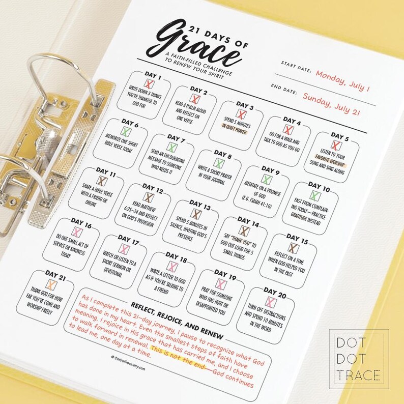 May include: A planner page with the text "21 Days of Grace" and daily prompts for spiritual reflection. The page is in a binder, with a yellow background and black text. The start date is Monday, July 1.