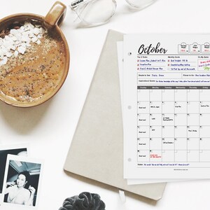 May include: A printable October calendar planner with a monthly grid, to-do list, and goal setting sections. The calendar is designed with a minimalist aesthetic and includes space for notes and reminders.