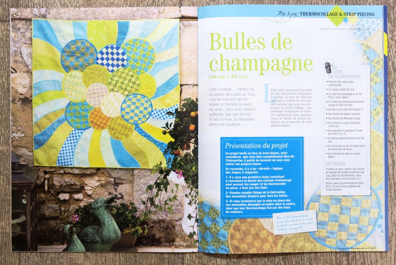 May include: A colorful quilt with a pattern of circles and stripes. The quilt is made of fabric scraps in shades of yellow, blue, and green. The quilt is titled "Bubbles de champagne" and is 30 inches by 30 inches.