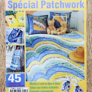May include: A magazine cover titled "Diana Ouvrages Spécial Patchwork" in French, showcasing patchwork designs. The cover displays a blue, yellow, and white patchwork quilt, a woman in a blue dress, and teddy bears.