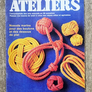 May include: A magazine cover featuring a colorful illustration of various rope knots. The title of the magazine is "ATELIERS" and the text below reads "l'encyclopédie des arts manuels en 98 semaines". The text at the bottom of the cover reads "Canada $1 France 5F Belgique 45FB Suisse 3,50FS".
