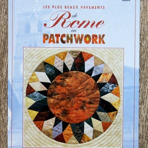 May include: Book cover with a blue background and the title "Les Plus Beaux Pavements de Rome en Patchwork". The cover features a colourful patchwork quilt design of a sunburst pattern.