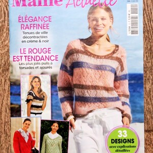 May include: A magazine cover titled "Maille Actuelle" featuring a woman wearing a pink, brown, and blue striped sweater. The cover includes text in French, with the words "ÉLÉGANCE RAFFINÉE" and "LE ROUGE EST TENDANCE". There are also images of other knitted garments.
