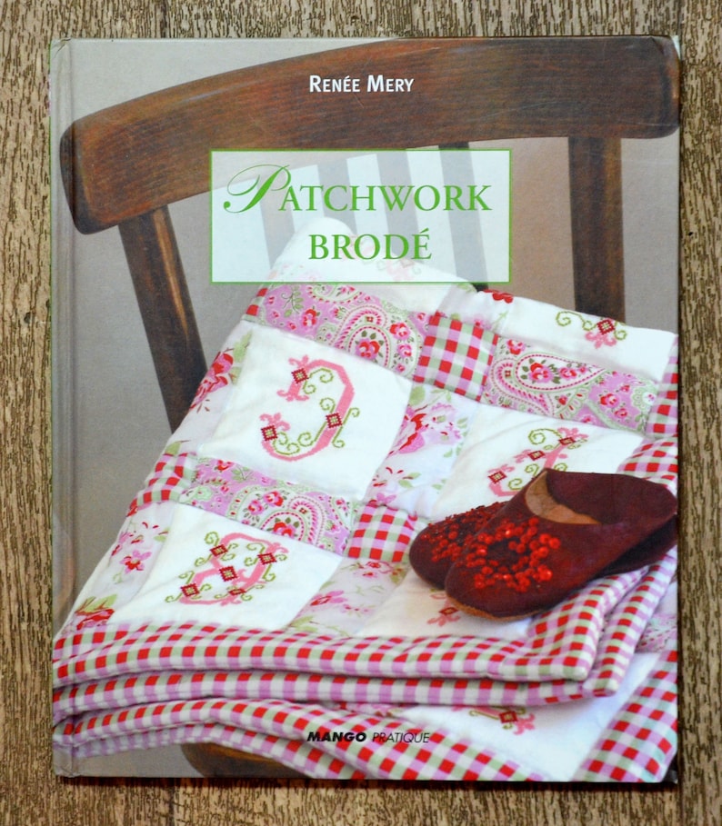 May include: A book titled "Patchwork Brod&eacute;" by Ren&eacute;e Mery, featuring a red and white gingham fabric with embroidered letters and a paisley pattern. The book cover shows a quilt with a red and white gingham border.