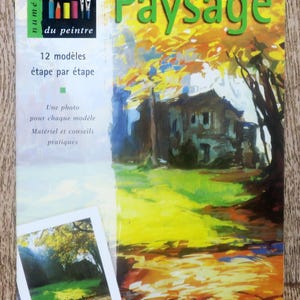 Peut inclure: Une couverture de livre avec le titre "Paysage" en texte vert. La couverture présente une peinture d'une maison dans un paysage avec des arbres et un chemin. Le livre fait partie d'une série appelée "Les cahiers du peintre" et comprend 12 modèles à peindre étape par étape.