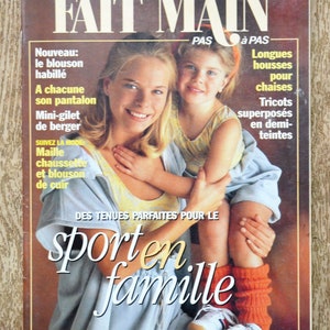 May include: A magazine cover featuring a mother and daughter in a sporty pose. The magazine is titled "FAIT MAIN" and the text "sport en famille" is featured in large letters. The magazine cover is from January 1995.