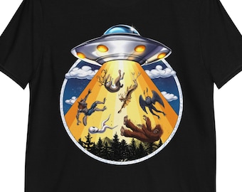 May include: A black t-shirt with a graphic of a flying saucer abducting a group of mythical creatures, including a deer, a wolf, a bird, and a Bigfoot. The graphic is set against a yellow and orange background with a blue sky and stars.