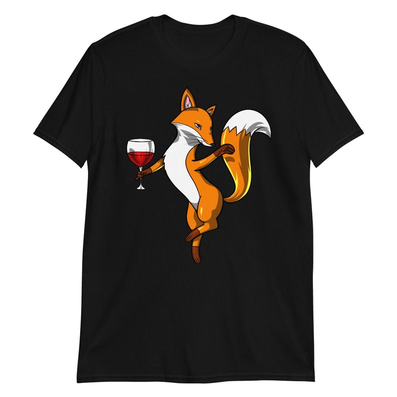 May include: A black t-shirt with a cartoon image of a fox holding a glass of red wine. The fox is orange and white with a bushy tail.